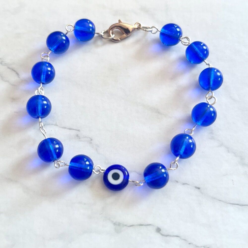 Dark Blue Round Glass Bead Bracelet with Evil Eye Lentil Bead